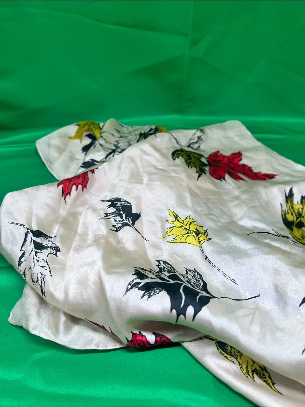 Cream Leaf-Print Scarf with Red, Yellow & Black Accents